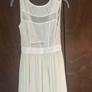 Angelic off white dress with sheer cut outs and size 6-8 dress.
